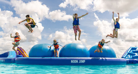 Kids Jumping Off Moon Jump Into Water